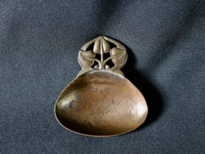 A E Jones bronze caddy spoon