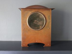 A E Jones copper and silver clock