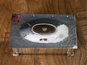 A E Jones silver plated cigarette box