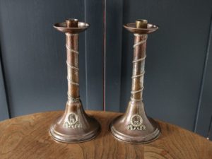 A E Jones copper candlesticks