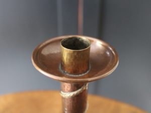 A E Jones copper candlestick