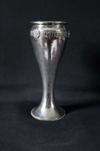 A E Jones silver motto vase