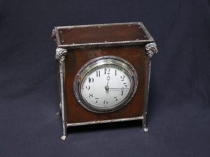 A E Jones bronze and silver clock