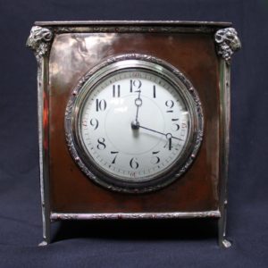 A E Jones bronze and silver clock