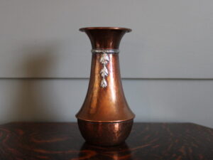 A E Jones copper and silver vase