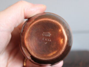 A E Jones copper and silver vase